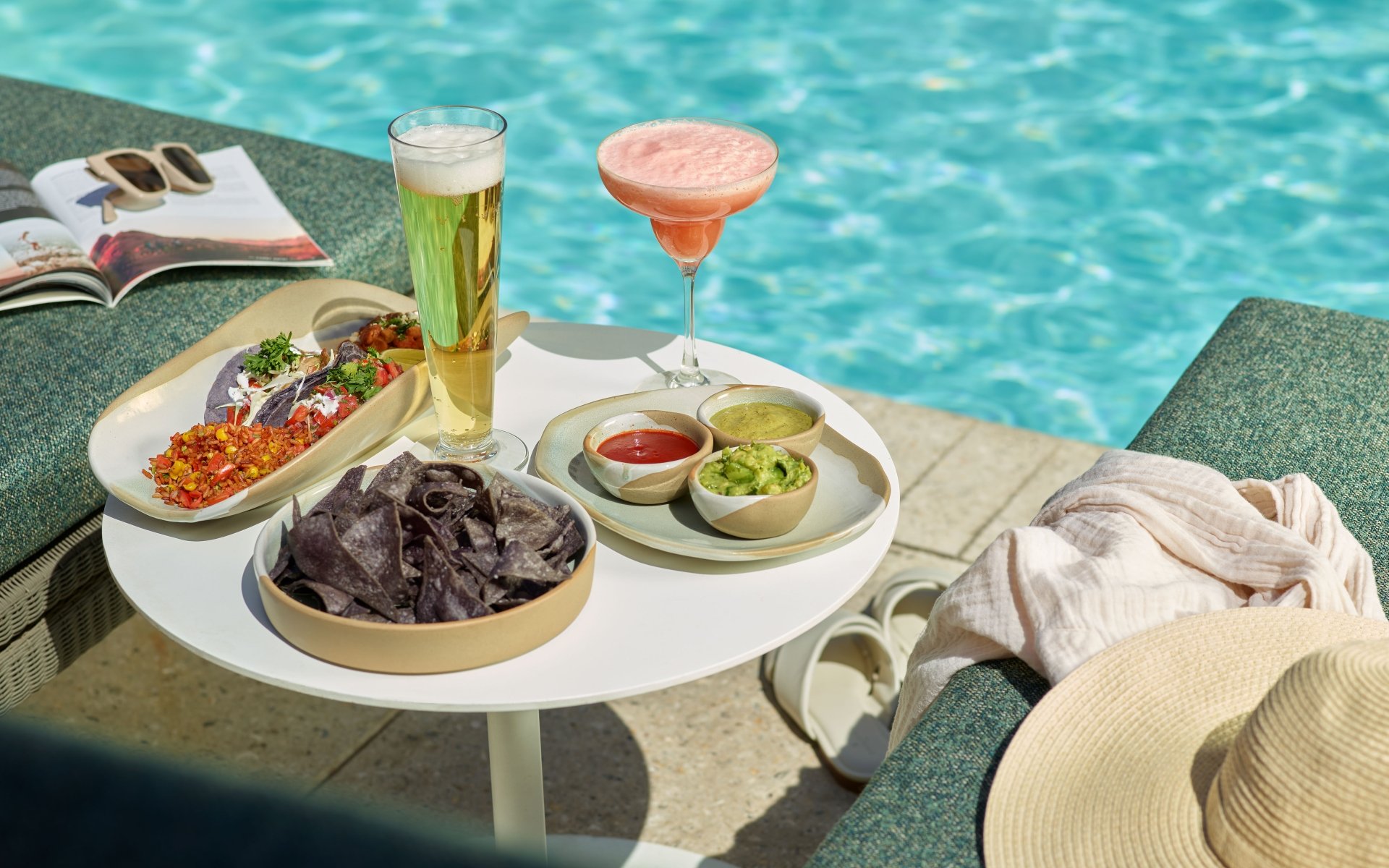 An assortment of snacks and drinks at Wade poolside bar