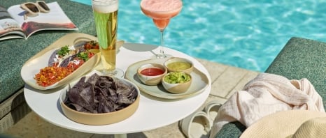 An assortment of snacks and drinks at Wade poolside bar