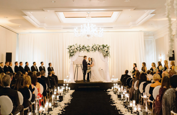 A bride and groom at the alter at the Camby