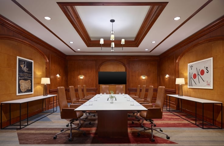 A large boardroom at the Camby with one large table setup for a meeting