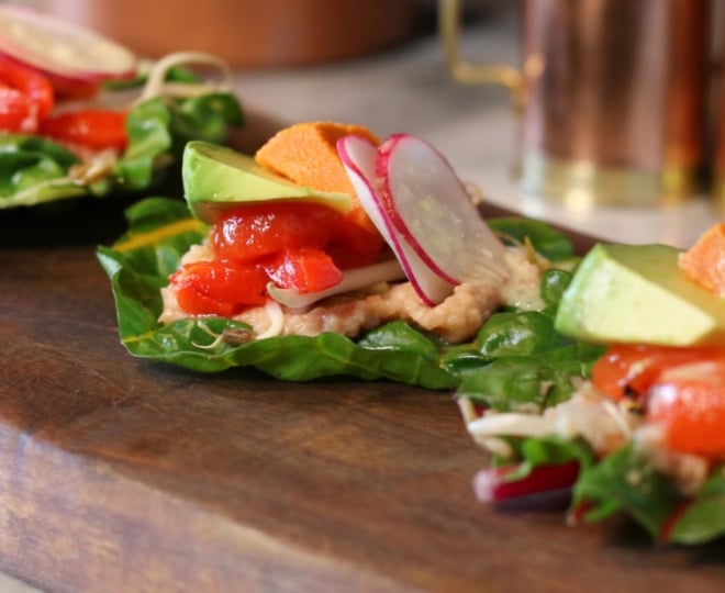 Small lettuce wraps on a wooden slab