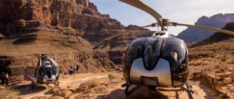 2 helicopters on the ground for Maverick Helicopter Tours in Arizona