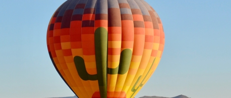 An air ballon in the desert for Rainbow Ryders Hot Air Ballon Ride in Arizona.
