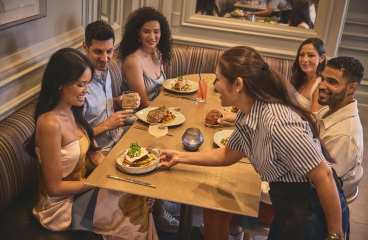 A group of people dining at Yellowbell in The Camby