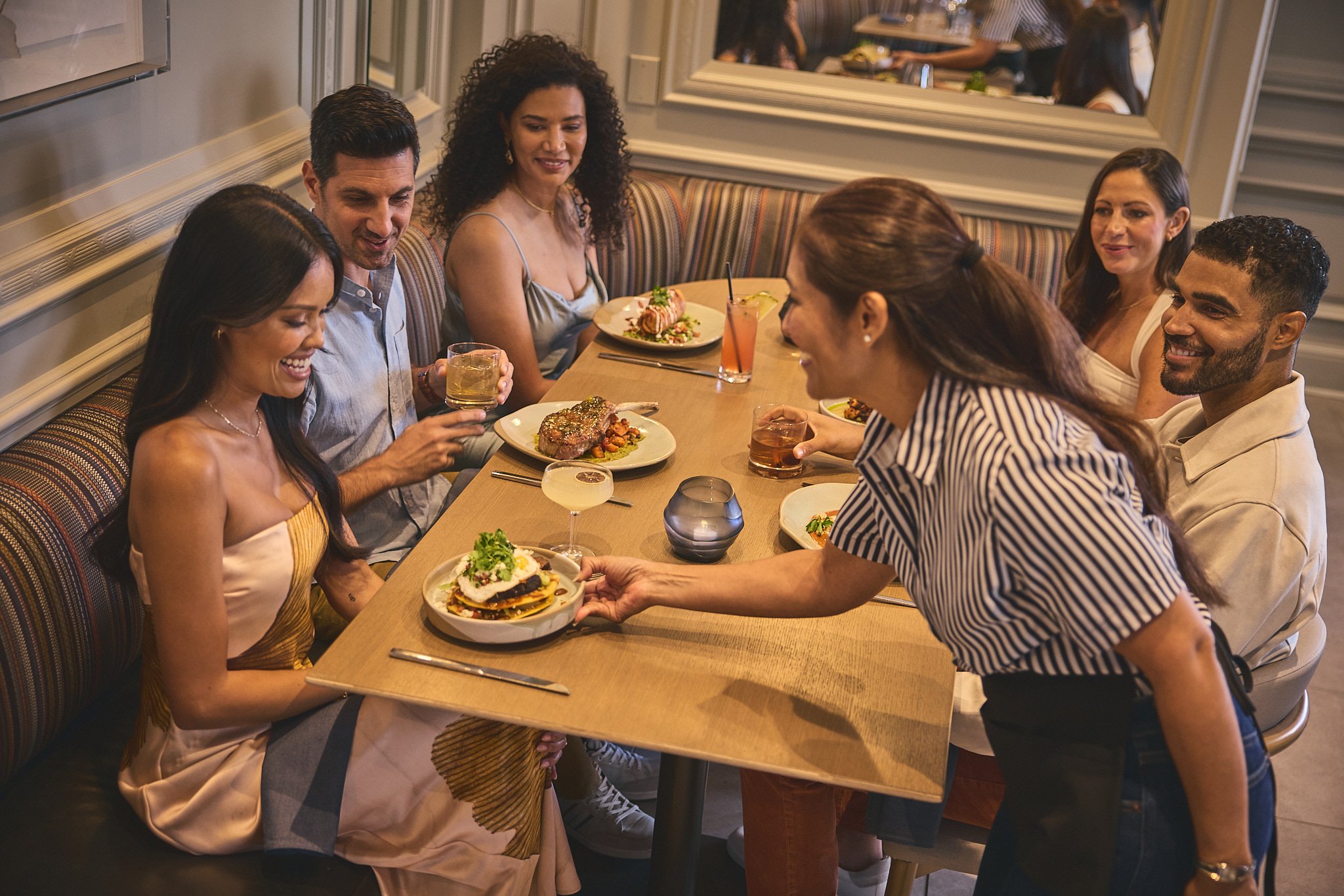 A group of people dining at Yellowbell in The Camby