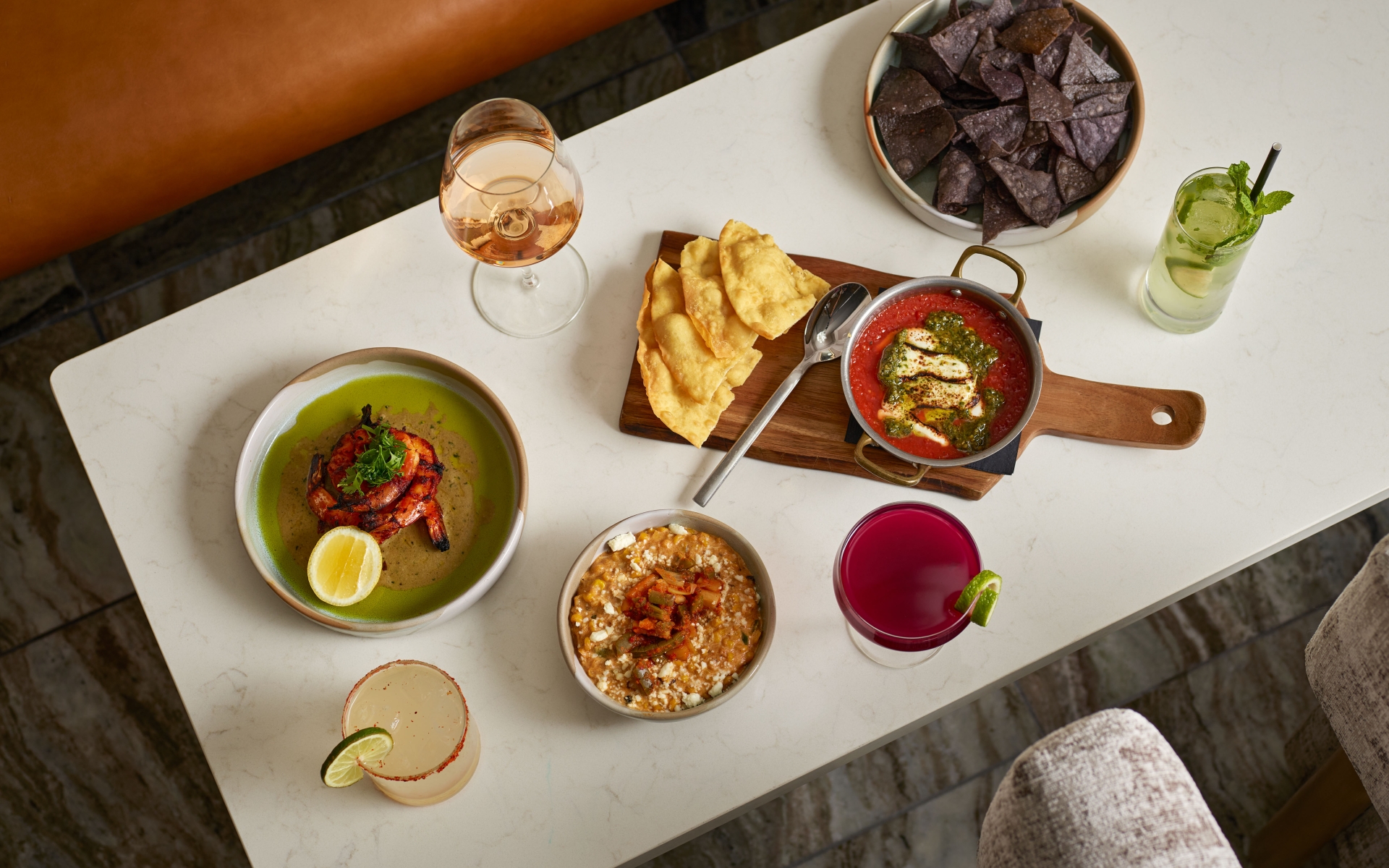 A spread of food and cocktails Yellowbell at the Camby