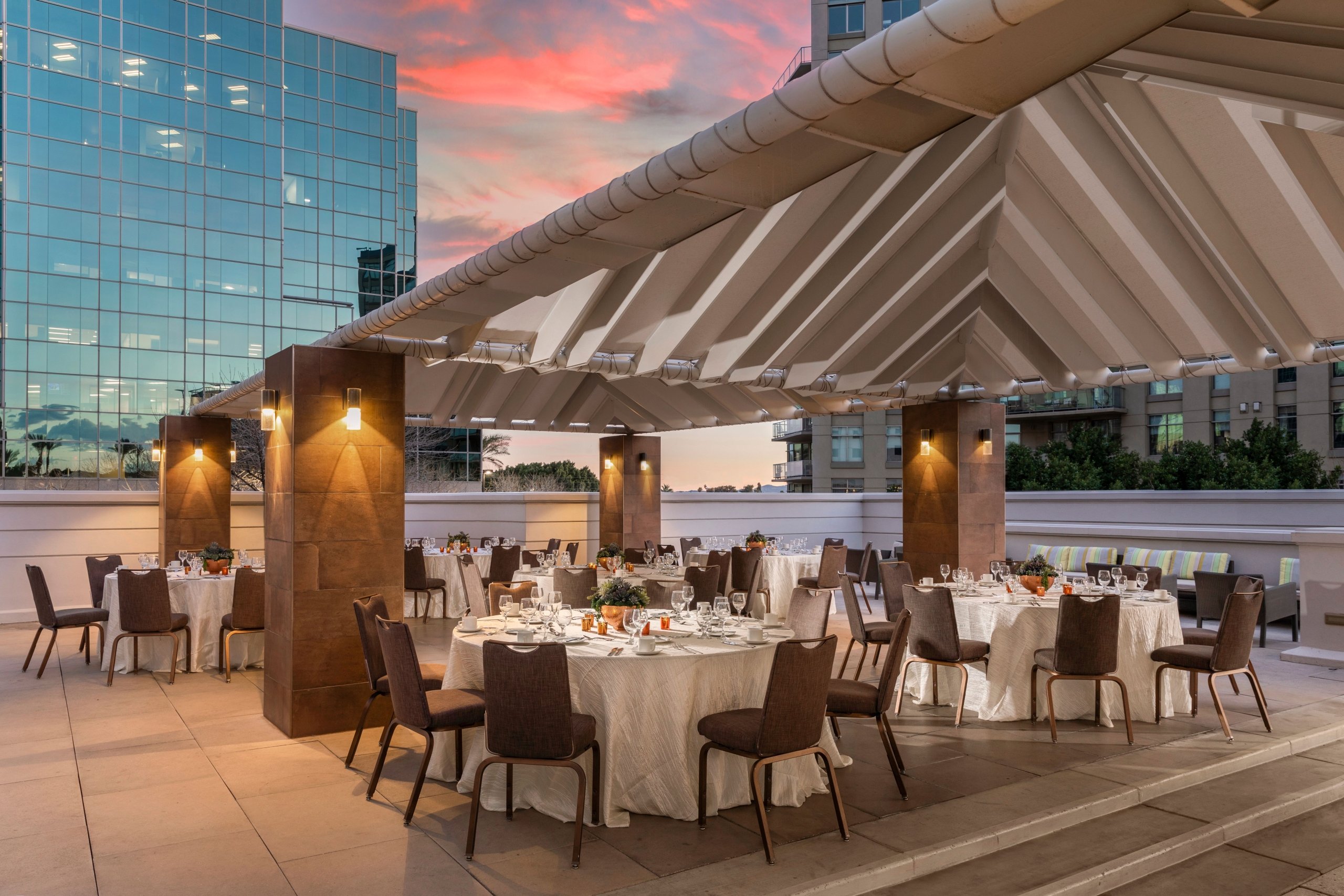 The pool deck venue setup for a gathering at sunset at the Camby