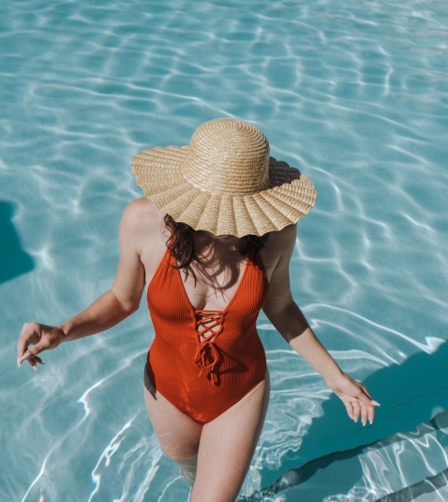 Camby Rooftop pool, red swimsuit, sun hat, swimming, woman