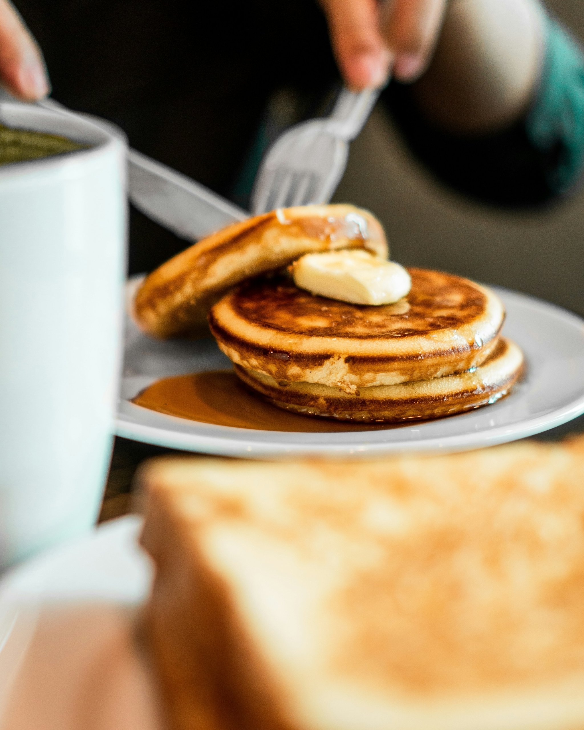 Pancakes with butter. Toast on the side.