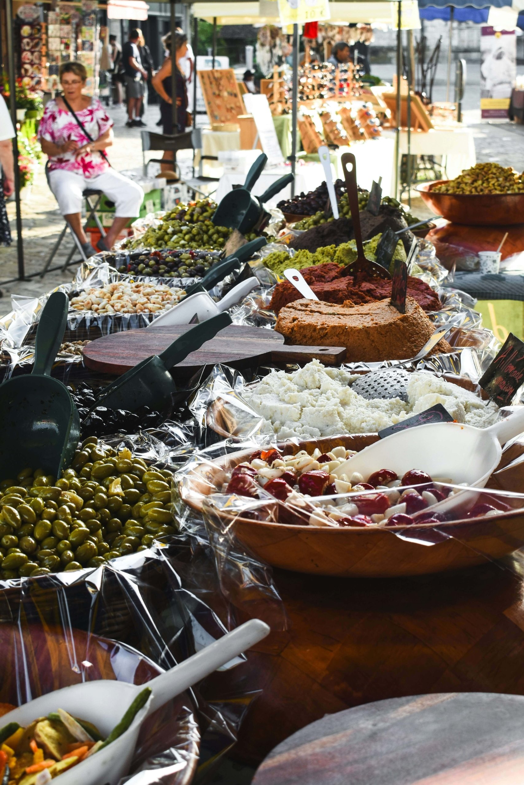 wine and food festival. olives, cheese, hummus in bowls displayed on a table