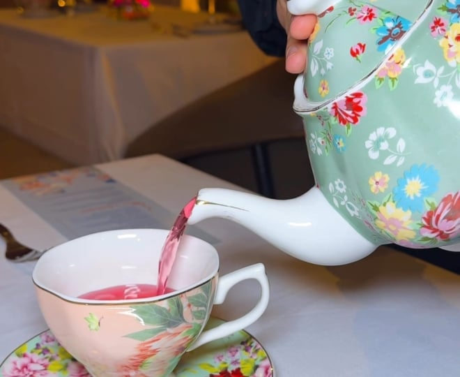 tea pot pouring into a tea cup